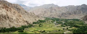 Most beautiful place in Kashmir — lush green valley with terraced fields and Himalayan mountains