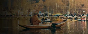 A local boatman rowing a shikara on Dal Lake, Srinagar — 7 days Kashmir itinerary