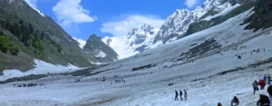 Best time to visit Kashmir for snow – tourists enjoying snow in Gulmarg valley during winter